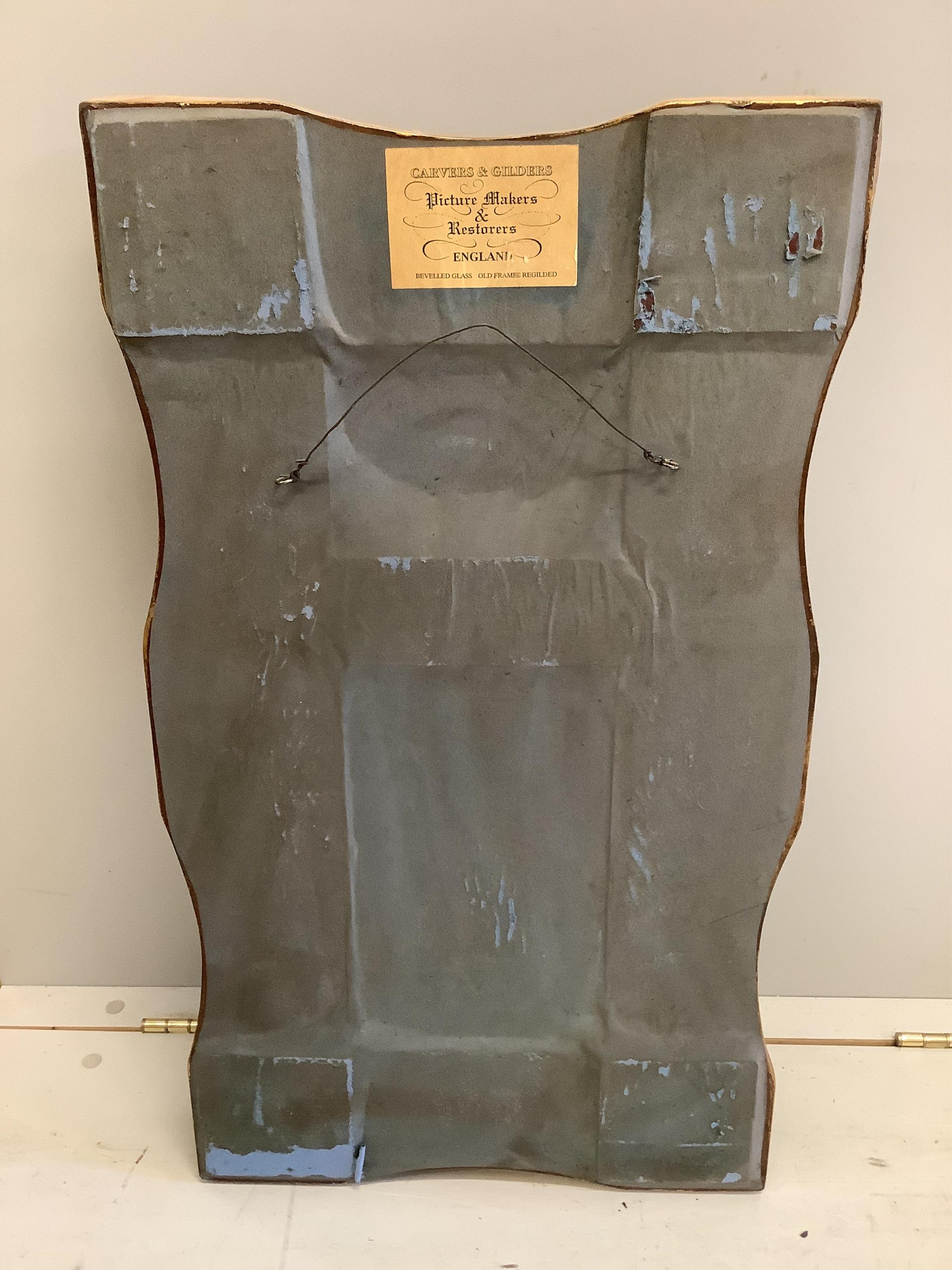 A pair of Victorian style gilt composition trumeau wall mirrors, width 44cm, height 78cm